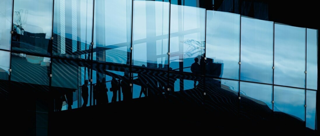 Photo by <a href="https://unsplash.com/@olgaschraven?utm_source=unsplash&utm_medium=referral&utm_content=creditCopyText">Olga Schraven</a> on <a href="https://unsplash.com/photos/modern-building-facade-with-glass-reflections-yEJ37R74dMo?utm_source=unsplash&utm_medium=referral&utm_content=creditCopyText">Unsplash</a>       